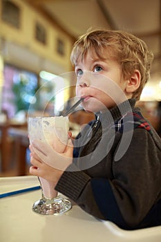 Kid drinking milkshake