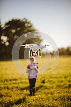 Kid with Dron in summer photo