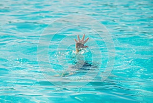 kid is drowning in the sea. Selective focus