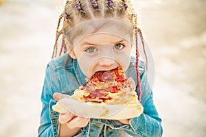 Kid eat pizza. Child eating pizza. Fastfood for kids. Italian junkfood. Children favorite food. photo