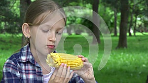 Kid Eating Boiled Corn Outdoor in Park, Girl Eats Healthy Snack Food, Child