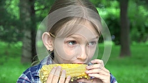 Kid Eating Boiled Corn Outdoor in Park, Hungry Girl Eats Healthy Snack Food, Young Blonde Child Relaxing Outdoor in Nature