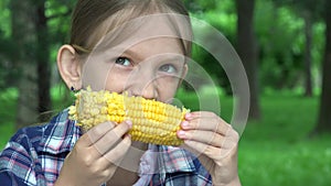 Kid Eating Boiled Corn Outdoor in Park, Hungry Girl Eats Healthy Snack Food, Young Blonde Child Relaxing Outdoor in Nature