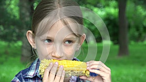 Kid Eating Boiled Corn Outdoor in Park, Hungry Girl Eats Healthy Snack Food, Young Blonde Child Relaxing Outdoor in Nature