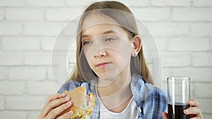 Kid Eating Fast Food, Child Eats Hamburger in Restaurant, Hungry Teenager Blonde Girl with Cheeseburger Sandwiches, Drinking Juice