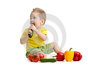 Kid eating healthy food and looking aside