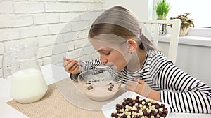 Kid Eating Milk and Cereals at Breakfast, Child in Kitchen, Teenager Girl Tasting Healthy Food at Meal, Nutrition