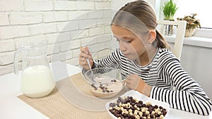 Kid Eating Milk and Cereals at Breakfast, Child in Kitchen, Teenager Girl Tasting Meal