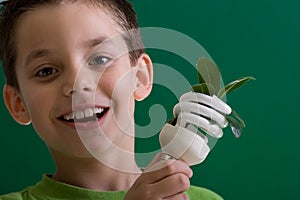 Kid with energy saving bulb