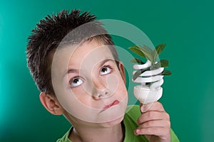Kid with energy saving bulb