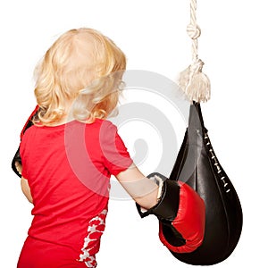 Kid exercising punching bag