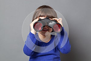 Kid exploration concept with binoculars