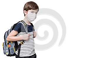 Kid with face mask holding school bag