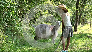 Kid Feeding Goat in Courtyard, Farmer Cowboy Child Pasturing Animals in Field, Rustic Girl with Animals in Garden