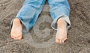 Kid feet in sand