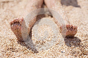 kid feet on the sand. rest and childhood. sea air