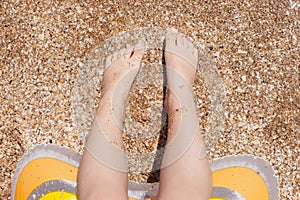 kid feet on the sand. rest and childhood. sea air