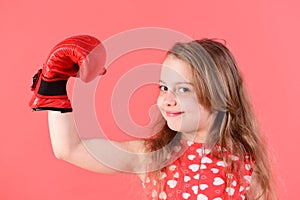 Kid flex arm with muscle, biceps, triceps in boxing gloves