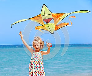 Kid flying kite outdoor.