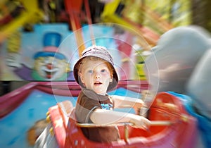 Kid on fun fair ride