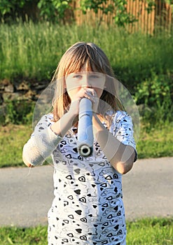 Kid - girl with blowpipe photo