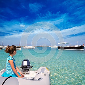 Kid girl in boat at formentera Estany des Peix photo