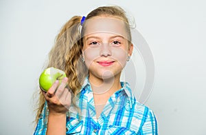 Kid girl eat green apple fruit. Vitamin nutrition concept. Reasons eat apple every day. Nutritional content of apple