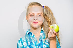 Kid girl eat green apple fruit. Vitamin nutrition concept. Reasons eat apple every day. Nutritional content of apple