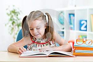 Kid girl learns to read book