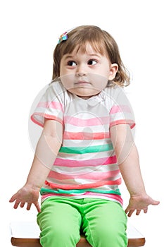 Kid girl looks puzzled, isolated