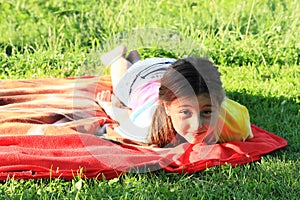 Kid - girl lying on towel