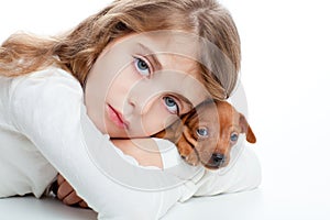 Kid girl with mini pinscher pet mascot dog