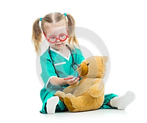 Kid girl playing doctor with toy