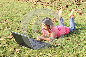 Kid - girl playing with notebook