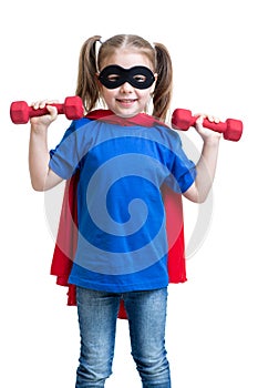 Kid girl plays superhero and lifts dumbbells