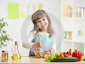 Kid girl preparing healthy food