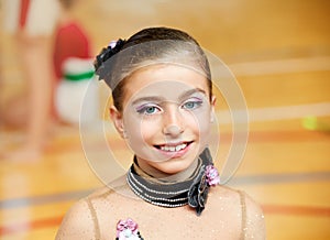 Kid girl rhythmic gymnastics on wooden deck