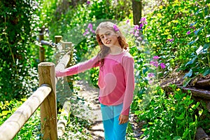 Kid girl in spring track in Cuenca forest of Spain photo