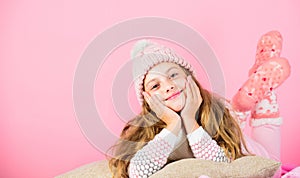 Kid girl wear cute knitted fashionable hat and scarf accessory. Winter accessory concept. Girl long hair dream pink