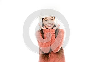 Kid girl wear hat with ear flaps white background. Soft furry accessory. Tips for caring for fur garments. Child long