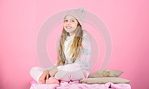 Kid girl wear knitted soft hat pink background. Keep knitwear soft after washing. Soft knitted accessory. Tips for