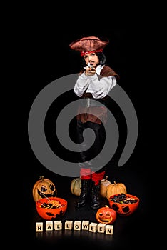Kid in halloween costume of pirate