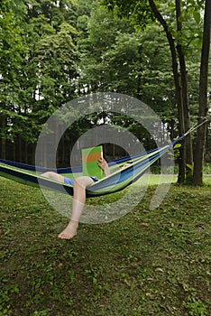 Kid on hammock with book