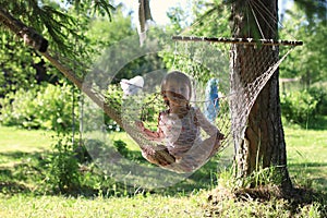 Kid in hammock on nature