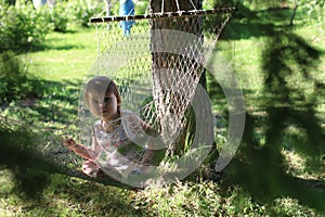 Kid in hammock on nature