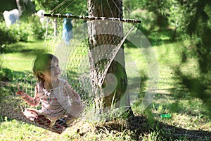 Kid in hammock on nature