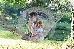 Kid in hammock on nature