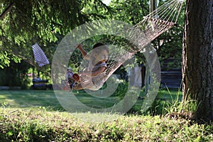 Kid in hammock on nature