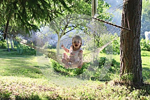 Kid in hammock on nature