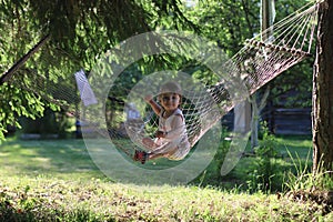 Kid in hammock on nature